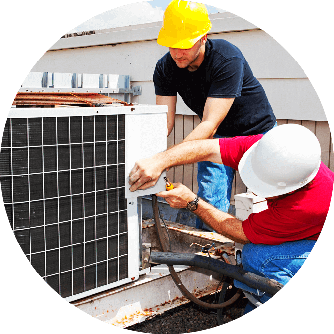 two staff fixing an air conditioner